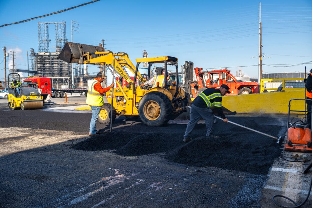 Specialized paving equipment operated by certified asphalt contractor